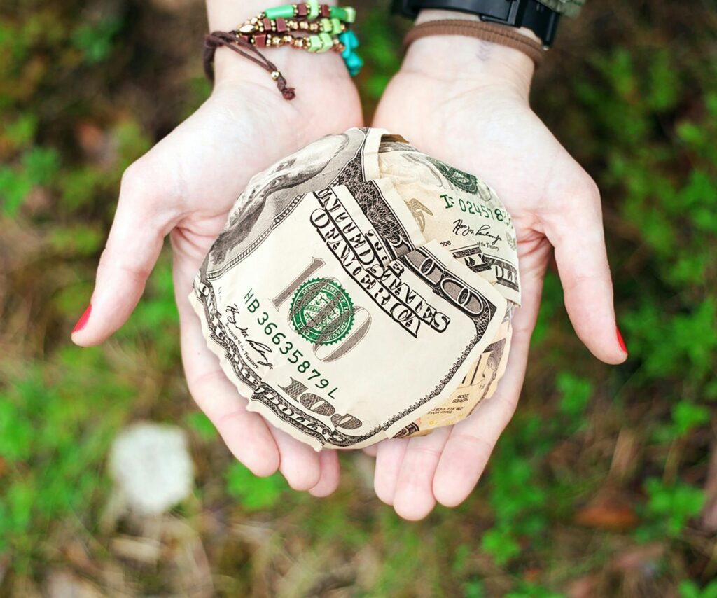 Person Holding U.s. Dollar Banknotes